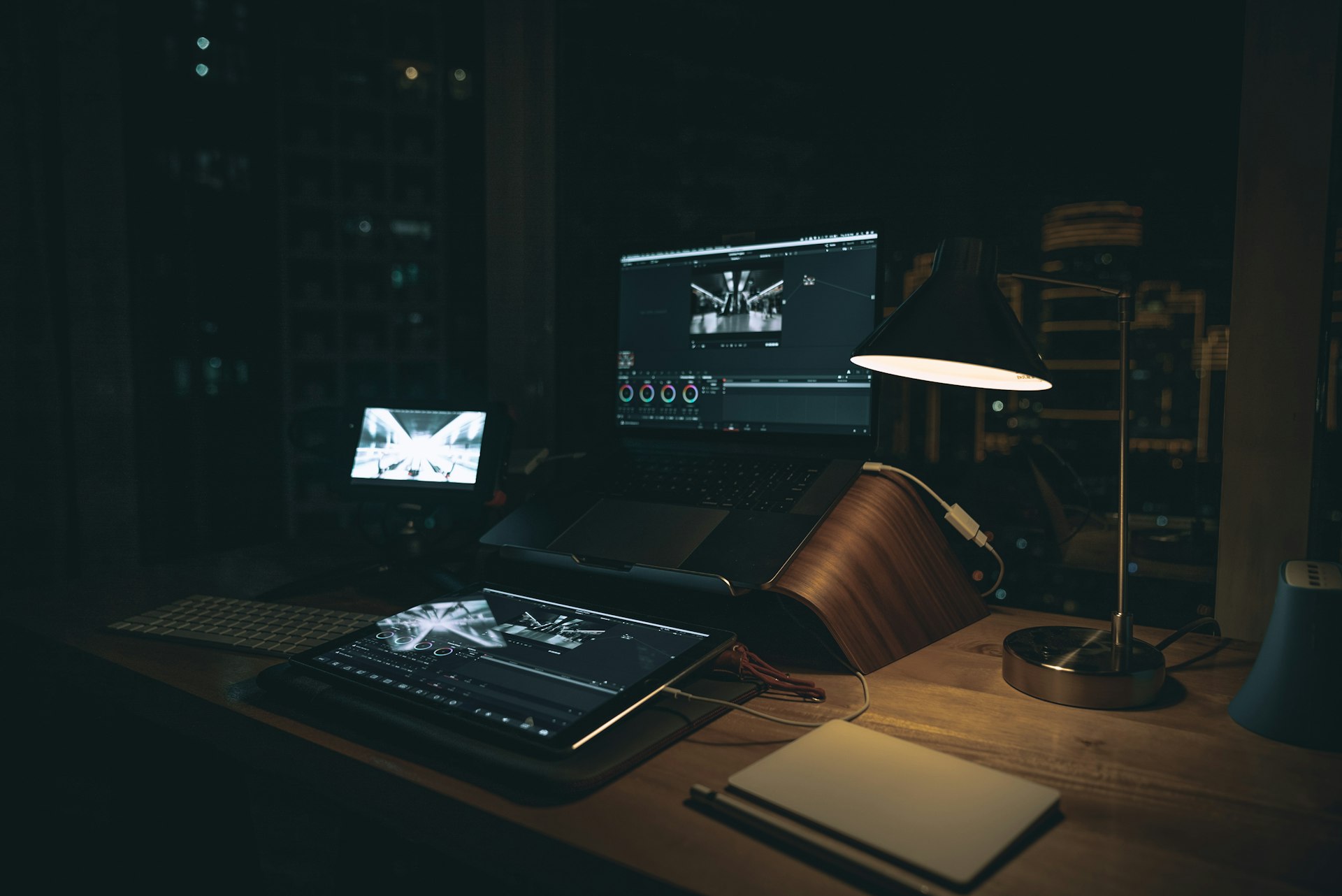black laptop computer on brown wooden stand